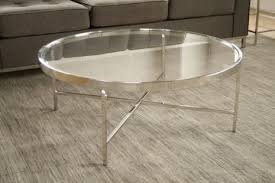 Coffee table is smooth and cool with a subtle silvery glint of crystallization. Mitchell Gold Vienna Round Cocktail Table