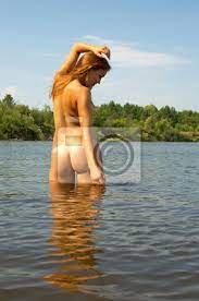 Naked girl bathes in the river. wall mural • murals naturism, naturist,  beatiful | myloview.com