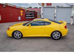Image result for Sunny Yellow 2004 Tiburon