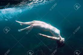 Beautiful Naked Woman Dive Underwater In Sea And Bubbles Stock Photo,  Picture And Royalty Free Image. Image 94228618.