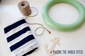 If you're really into the nautical theme, you can dedicate an entire wall in your home to give it a seaside feel. Nautical Decor How To Make This Navy And White Wreath