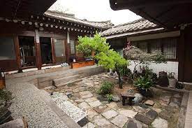 The house's entrance leads into a simple hallway, where a large window directly in front frames a view of the courtyard and tree. Pin On Æ¹ Ó‚ Ê' Courtyard S Æ¹ Ó‚ Ê'