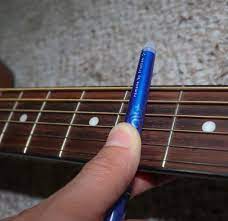 Using a capo is easy. 4 Steps On How To Make Homemade Guitar Capo Diy