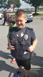 Officers Jim Goff and Jeff Kinney participated in the Back to School shop  with a cop program this morning. These two young men had a blast in the  lights and siren parade