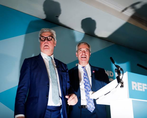 Farage dodges press as he unveils Reform's first peer after Conservative  defection | Reform UK | The Guardian