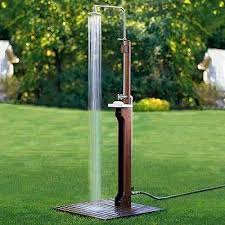 A miniature shower is perfect for rinsing off hands and feet made grimy by the great outdoors. Outdoor Kitchen Outdoor Shower Kits Outdoor Shower Outdoor Pool Shower