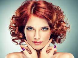 Hairstyles For Short Curly Hair Close Up Of A Woman With A Red Curly Bob And Side Part Wearing Glo Which Hair Colour Makeup For Green Eyes Curly Hair Styles