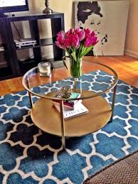 Living Room With Flower Vase In Glass Top Round Coffee Table Glass Coffee Table Decor Round Glass Coffee Table Coffee Table Inspiration