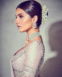 Style your hair in loose curls. Best Bun Hairstyles Found On Bollywood Celebrities