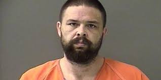 Man shot by local officer jailed after release from hospital