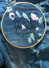 An orginal crewel embroidery design is waiting to embellish a pair of your blue jeans. Diy Floral Embroidered Denim Jeans