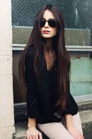9 Groovy 70s Hairstyles That Are Making A Huge Comeback Hair Styles Long Hair Styles Dark Purple Hair