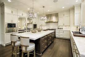 Matte black hardware defines the white cabinetry and multiple faucets while the polished nickel pendants dress the floating space without demanding recognition. Recipe For A Mixed Metal Kitchen Abruzzo Kitchen And Bath