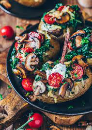 Easy Stuffed Baked Potatoes With Spinach Mushrooms Tomatoes And Vegan Cheese This Oven Ba Baked Potato Recipes Stuffed Baked Potatoes Baked Potato Toppings