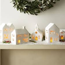 Shop White Ceramic Houses Filled With A Glowing Tealight Our White Stoneware Dwellings With C Christmas Inspiration Christmas Decorations Christmas Fireplace