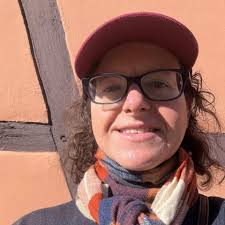 What city is worth visiting between Munich and Brussels?