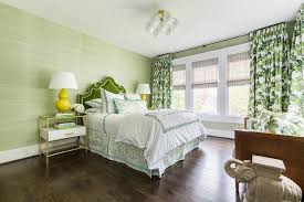 Complete the look with the parmelee club chair and parmelee club chair, as well as mathes stripes lumbar pillow. Green Velvet Headboard With Yellow Lamps Transitional Bedroom