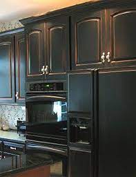 High, this kitchen storage cabinet maximizes vertical space to. Auction Girl Vintage Kitchen Remodel Inspiration Photos Distressed Kitchen Cabinets Black Kitchen Cabinets Kitchen Remodel Inspiration