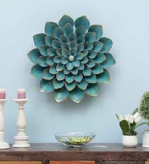 Yes, you're stuck behind your computer but that spectacular mountain scene on your screen reminds you that you will soon be out in nature, breathing fresh air and watching the sunlight filter through the trees. Buy Flower Cutting Wall Art In Cyan By Mahalaxmi Art And Crafts Online Floral Metal Art Metal Wall Art Home Decor Pepperfry Product