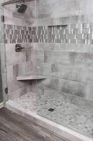 We did not find results for: Grey Tiled Shower With Accent Tile Strip And Niche Bathroom Tile Designs Shower Tile Shower Accent Tile