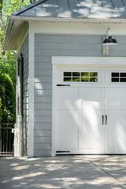 Family Home With Grey Exterior And Interiors Home Bunch An Interior Design Luxury Homes Blog Garage Door Trim Garage Doors Garage Door Lights