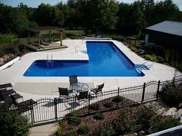 Discover pool deck ideas and landscaping options to create your poolside dream. L Shaped Swimming Pool Wisconsin L Shapes Pool Designs Swimming Pools Inground Backyard Pool Swimming Pools Backyard