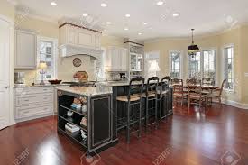 Acacia hardwood flooring hardwood floor colors wood laminate flooring dark wood floors wide plank flooring engineered hardwood flooring diy shiny floors, house smells grand. Luxury Kitchen With Marble Island And Cherry Wood Floors Stock Photo Picture And Royalty Free Image Image 6733426