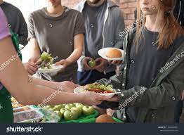 Volunteers Giving Food To Poor People Indoors Closeup Sponsored Affiliate Food Giving V Giving Food To Poor People Poor People Presentation Architecture