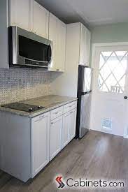 Transforming an unfinished basement into an apartment or suite definitely qualifies as a major home makeover. Compact Cute White Kitchen In A Mother In Law Suite Kitchenspiration Mother In Law Apartment In Law Suite Mother In Law Cottage
