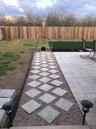 Backyard Pathway Designed With Diagonally Places Pavers And Pebble Rocks Lawnmowerbladeknife Small Backyard Landscaping Patio Stones Patio Pavers Design