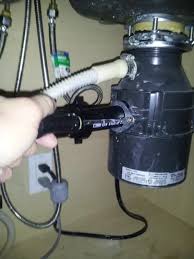 Rotate the disposer until the discharge tube is aligned with the drain trap. Garbage Disposal Is Spinning But Will Not Drain How To Fix