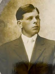 Dr. Simeon David Bateman, M.D., in front of his home near the county line  between Jackson and Independence Counties. On the balcony are his wife Mary  Ann and probably their daughter, Mary