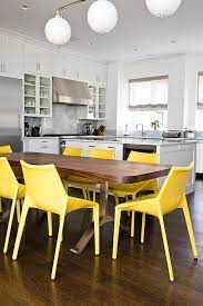 Thanks for visiting our yellow kitchen photo gallery where you can search yellow kitchen design ideas. Canary Yellow Plastic Dining Chairs With Brass And Wood Live Edge Table Modern Kitchen Plastic Dining Chairs Cheap Dining Chairs Yellow Dining Chairs