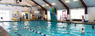 Sticks, balls, gameroom accessories, billiards supplies, tables, inside pool. Lava Hot Springs Indoor Swimming Pool Open Year Round Indoor Aquatic Center