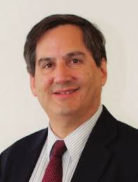 Axelrod to students: “Steer us to a better place.”