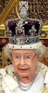 Two Crowns 3 000 Gems An 18ft Robe And A Recycled Dress Queen Elizabeth Ii Looks Regal Alongside Prince Philip At Her 60th State Opening Of Parliament Royal Crown Jewels Queen Elizabeth