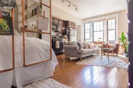 Using simple ikea pax sliding wardrobe doors with frosted glass inserts. The Best Bookcase Room Dividers Apartment Therapy