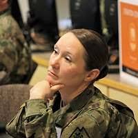 U.S. Army Command Sgt. Maj. Kristine Purnell gives