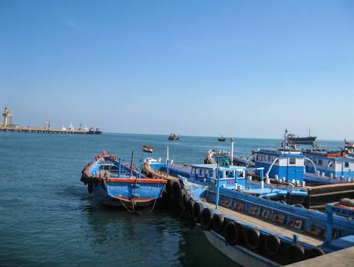 Colorful fishing boats lined up at Wadi sea shore, Kollam.