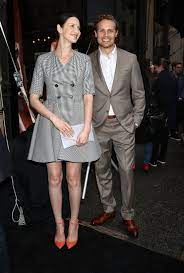 She started modeling at the age of 19 after she was scouted by an agent while she was collecting money for charity at a local mall. Caitriona Balfe Sam Heughan Outlander Saks Avenue 2