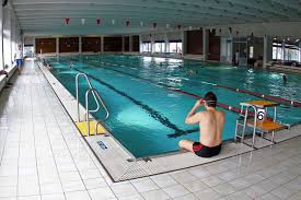 An artificial area of water for swimming, or a building containing this: Swimming Pools Stadt Langen Hessen