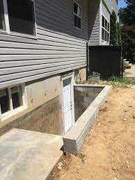 It can also lend aesthetic to any structure. Outside Entrance Basement Door Egress Windows Long Island N Y Exterior Access Doors Adds Value And C Basement Entrance Basement Windows Basement Doors