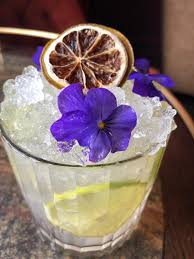 You know what they say: Tequila Mockingbird Garnished With Edible Flowers And Dehydrated Lime Cocktails