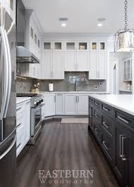 White Kitchen With Dark Kitchen Island And Stainless Steel Appliances Dark Kitchen White Kitchen Shaker Kitchen Cabinets