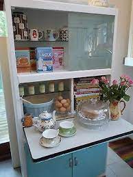 If you have limited kitchen cabinetry, make use of bookshelves as your extra storage space. This 1950 S Kitchen Cabinet Is Great Design Inspo For The Van Build Vintage Cupboard Vintage Kitchen Decor Kitschy Kitchen Decor