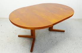 Fine dining room tables solid wood wharfside danish. Mid Century Danish Modern Round Teak Expanding Dining With Etsy Danish Modern Table Teak Dining Table Dining Table With Leaf