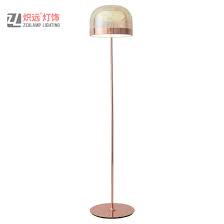 Featuring a rose gold finish, this floor light is characterised by a downward facing bowl shade and a convenient floor switch, making an attractive yet practical addition to the bedroom, living room or study. China Mushroom Rose Gold Metal Cognac Glass Hotel Standing Floor Lamp China Floor Lamps For Living Room Standing Lights