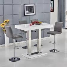 My treadmill/desk has a lot of matte black furniture, so i suppose the chrome finish is a bit of a contrast, but honestly in my home office i'm not too concerned. Caprice Bar Table In White Gloss With 4 Ripple Grey Bar Stools Grey Bar Stools Bar Table Bar Stool Furniture