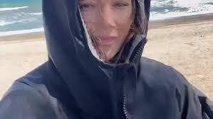 Michelle keegan wears flip flops and coat