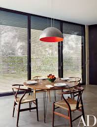 Legs are made of solid beech wood in a light oak. 10 Midcentury Modern Dining Rooms Architectural Digest